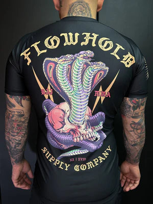 Model wearing Flowhold’s Cobra Core Rashguard – back view