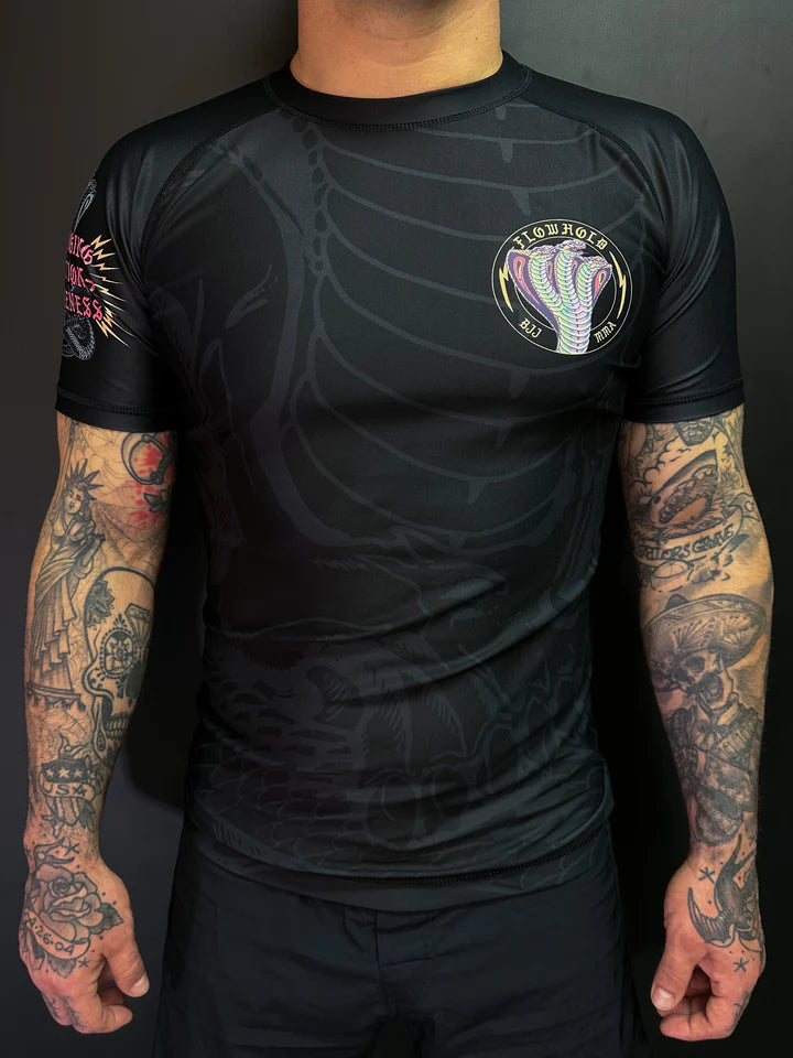 Model wearing Flowhold’s Cobra Core Rashguard – front view