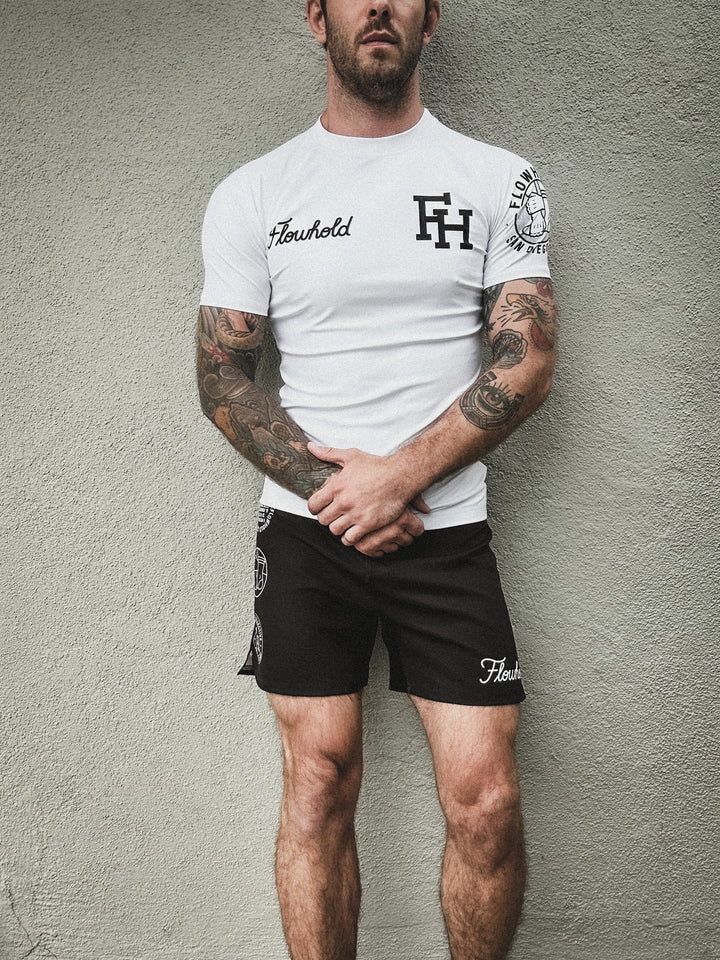 Model wearing Flowhold’s Defeater Fight Shorts – front view