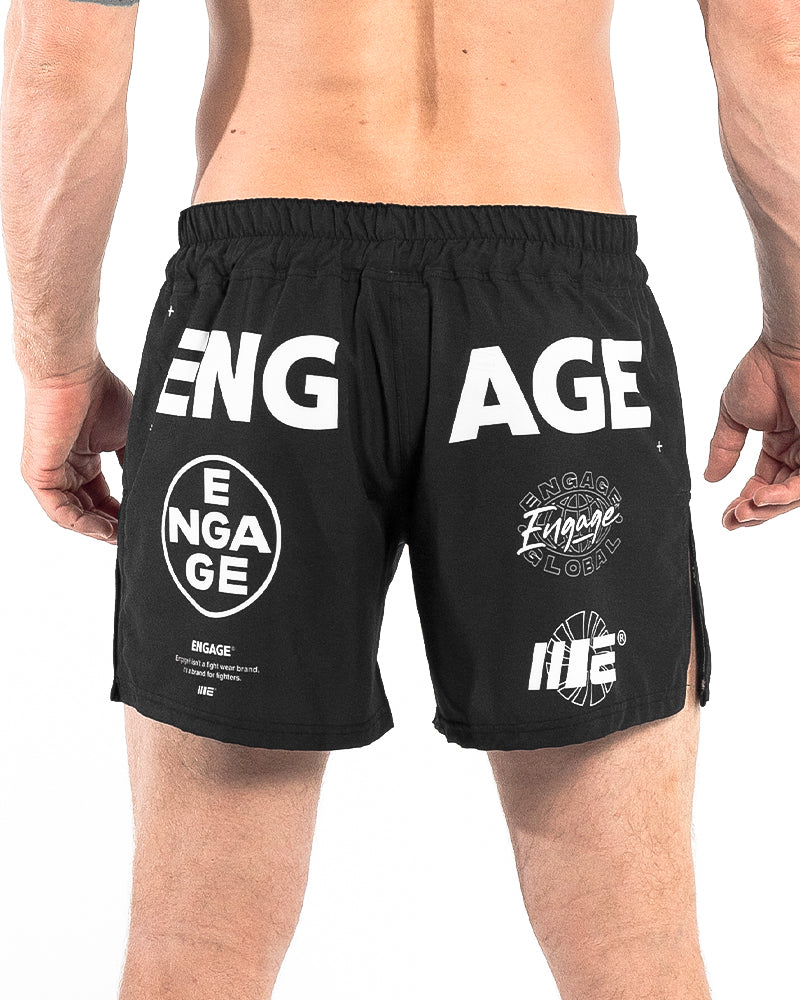 Back view of Engage Billboard MMA Hybrid Shorts Black on model