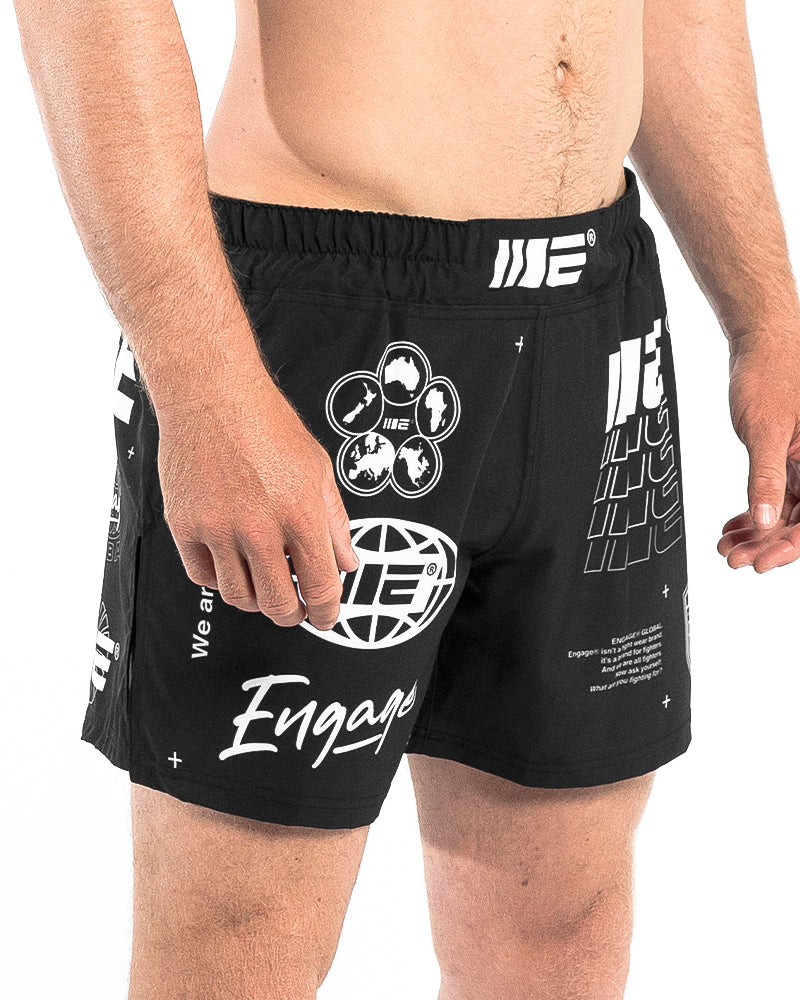 Side front view of Engage Billboard MMA Hybrid Shorts Black on model