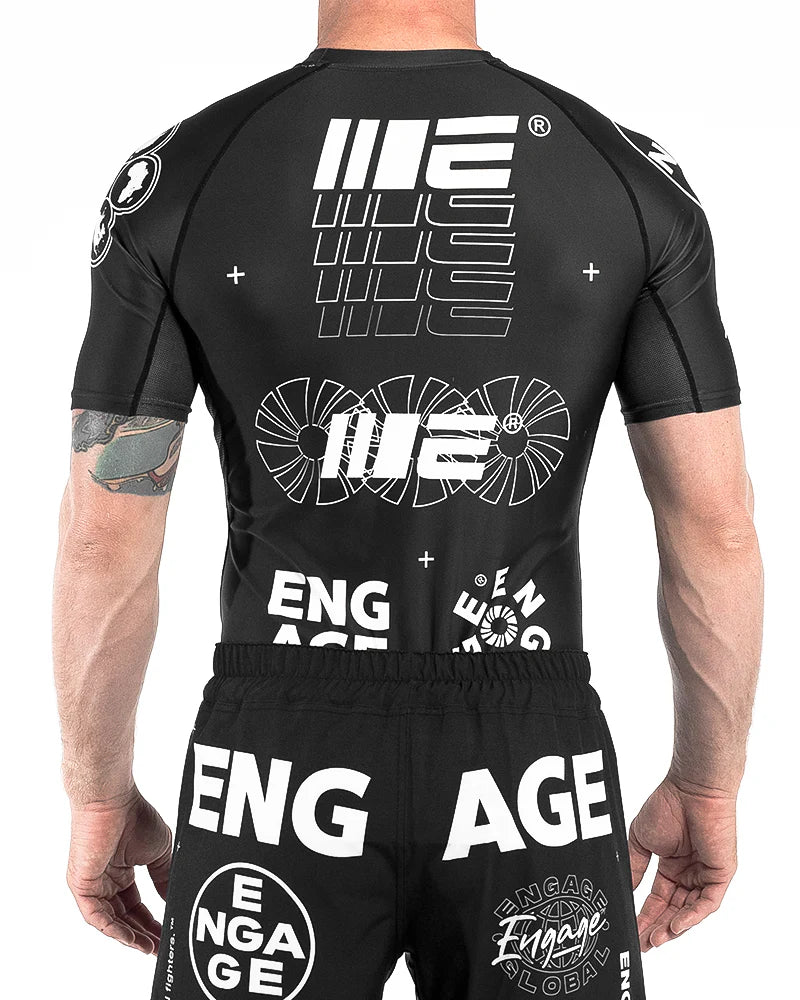 Back view of Engage Billboard Short Sleeve Rash Guard Black worn by model