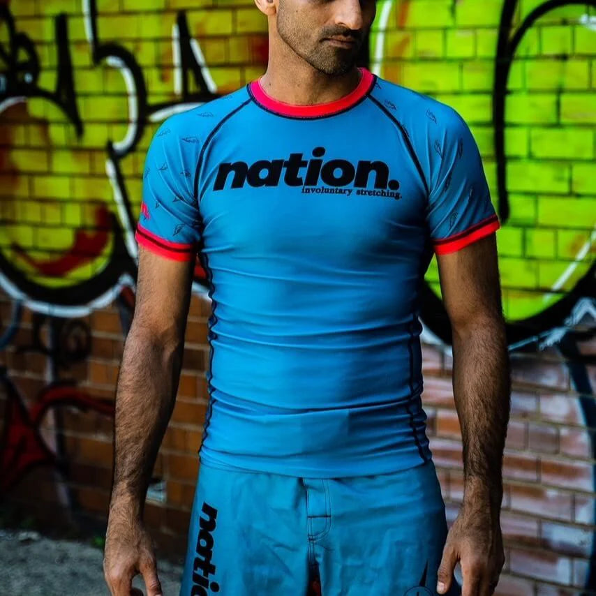 front view of Murder Yoga BJJ Grappling rash guard in blue –  No-Gi rash guard for MMA and wrestling
